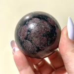 Load image into Gallery viewer, Eudialyte in Arfvedsonite Sphere - Ruby&#39;s Minerals
