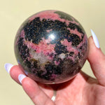 Load image into Gallery viewer, Rhodonite Sphere - Ruby&#39;s Minerals
